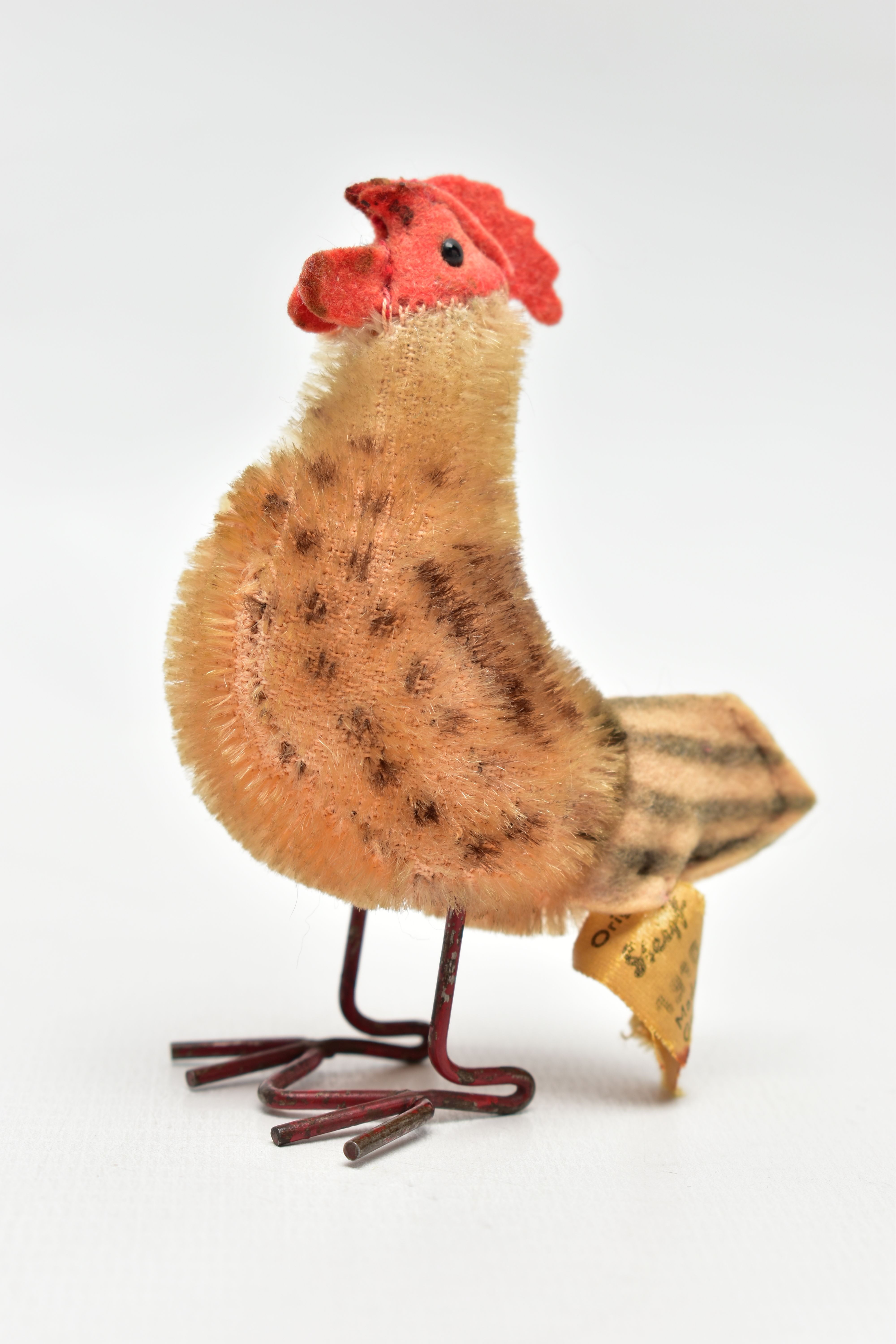 A POST-WAR STEIFF MOHAIR HEN WITH METAL WIRE LEGS, metal button and yellow tag to tail feathers, tag