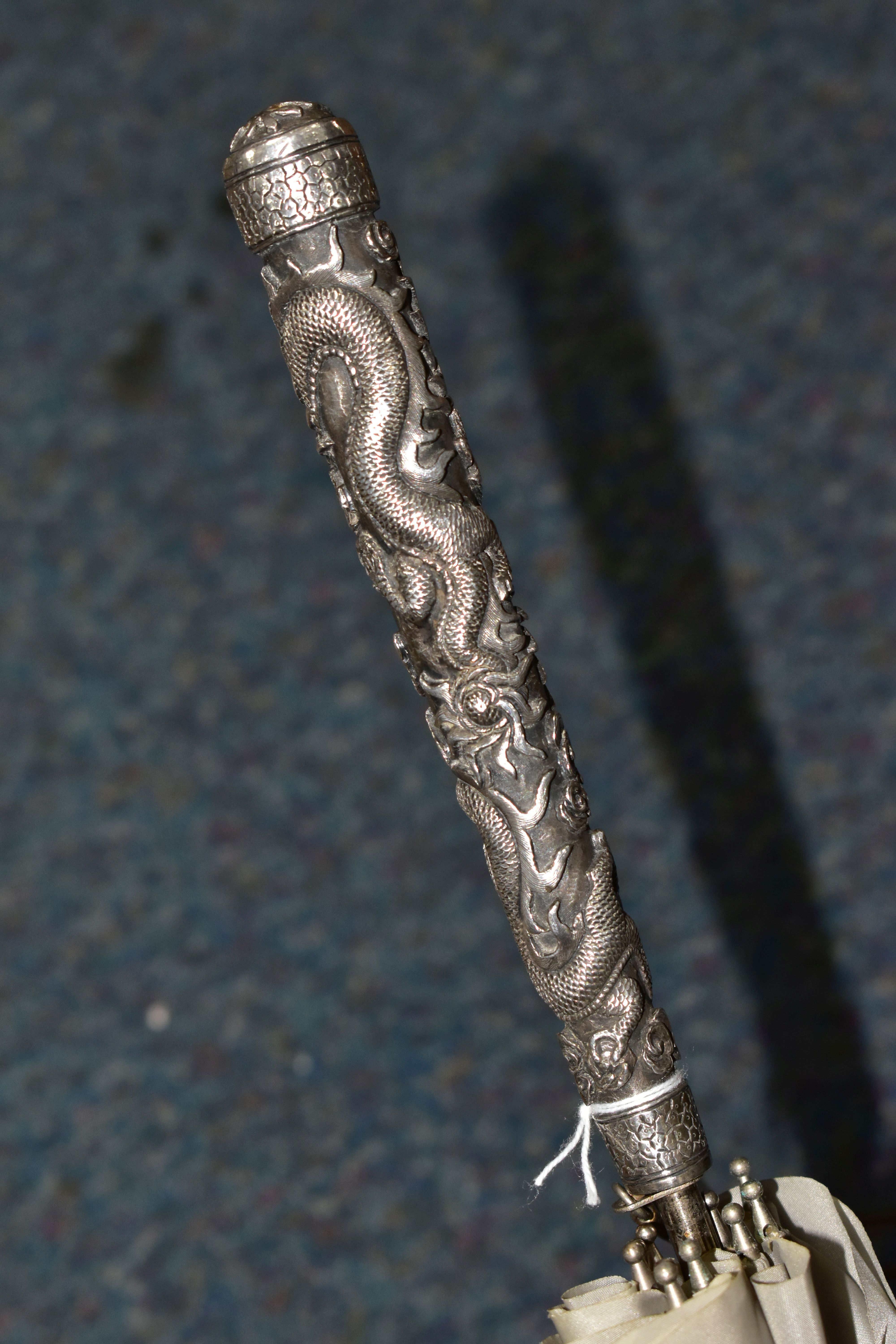 A CHINESE SILVER AND GREY UMBRELLA/PARASOL, with a white metal handle embossed with Dragons, - Image 5 of 7