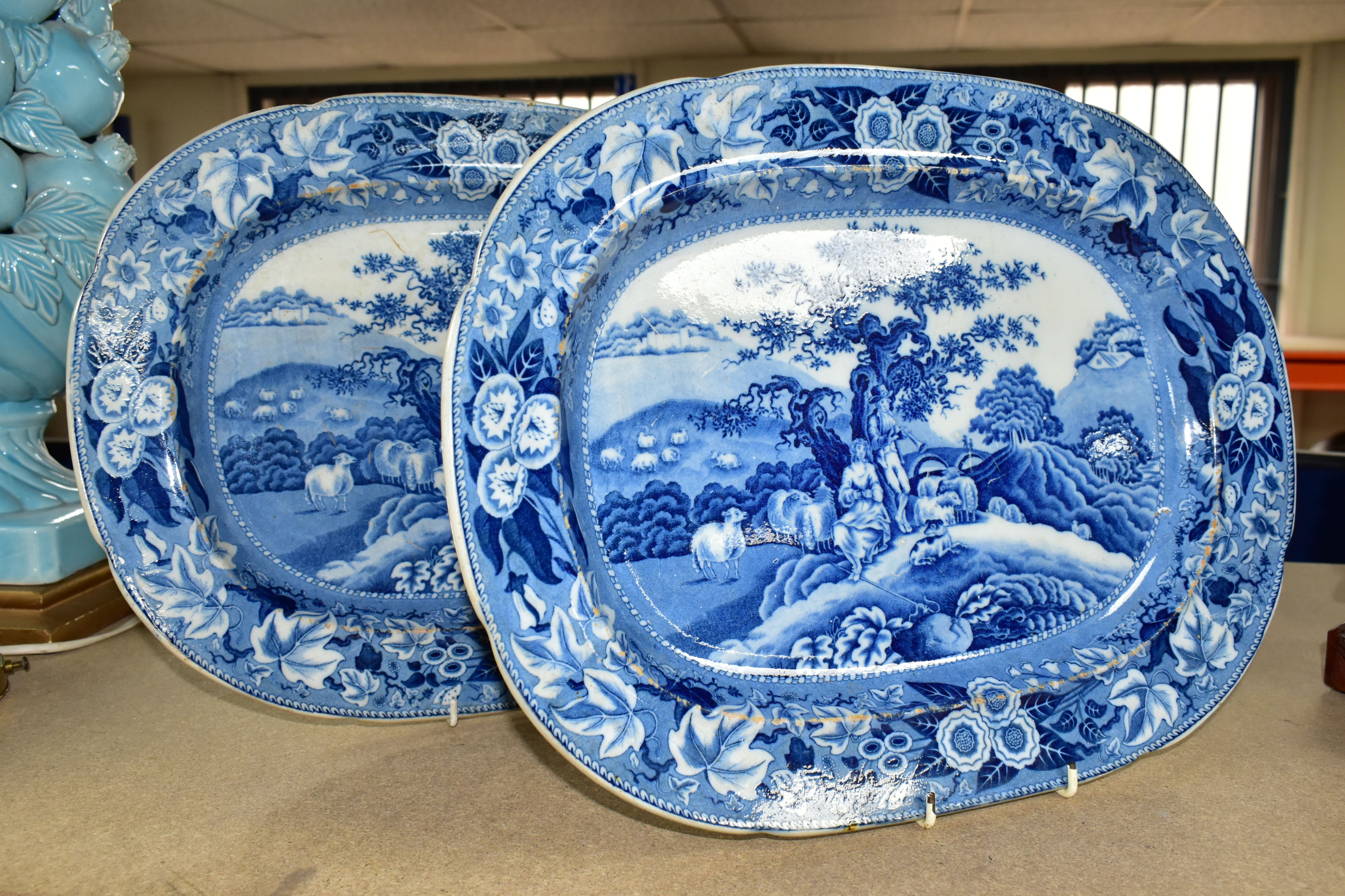 TWO 19TH CENTURY BLUE AND WHITE MEAT PLATES, both in a rectangular form, decorated with a resting