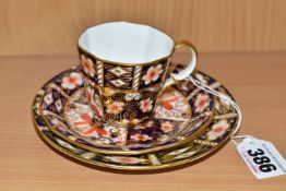 A ROYAL CROWN DERBY COFFEE TRIO IN IMARI 2451 PATTERN, bearing date codes for 1920, 1932 and 1933 (