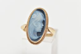 A 9CT GOLD CAMEO RING, oval hardstone form, depicting a lady in profile, collet set within a fine