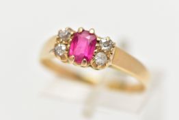 A YELLOW METAL GEM SET RING, centring on a rectangular cut synthetic ruby, flanked with three old