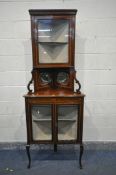 AN EDWARDIAN MAHOGANY AND BOX STRUNG CORNER CUPBOARD, top with a single glazed door, enclosing a