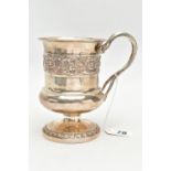 A GEORGE III SILVER TANKARD, baluster form, decorated with embossed floral design, fitted with a