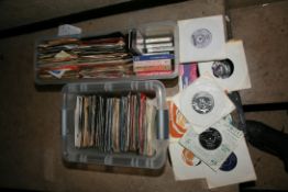 TWO TRAYS CONTAINING APPROX TWO HUNDRED 7in SINGLES AND CASSETTE TAPES artists include The