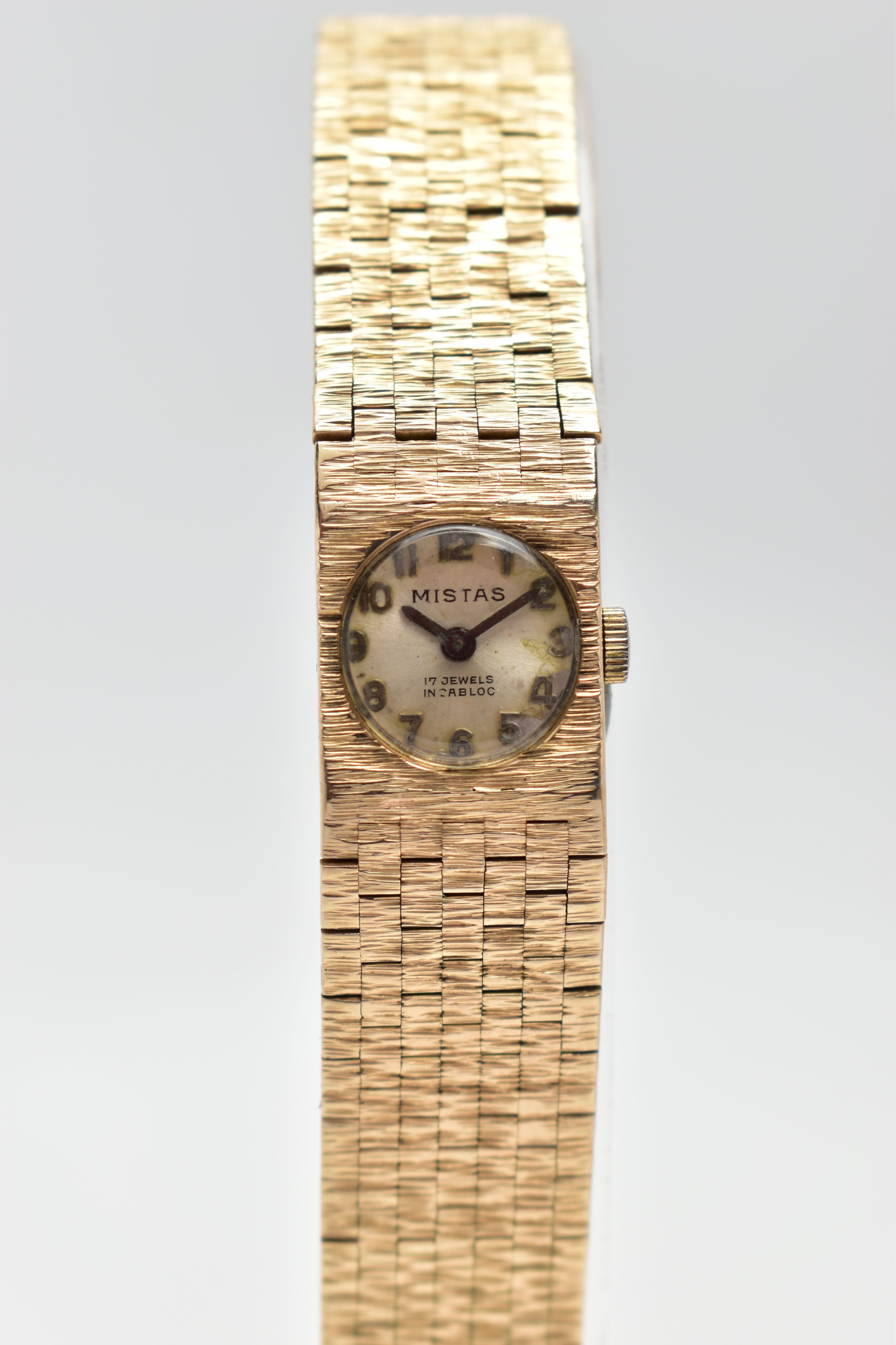 A LADIES 1970'S, 9CT GOLD 'MISTAS' WRISTWATCH, manual wind, round champagne dial signed 'Mistas,