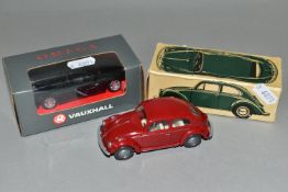 TWO BOXED MODEL CARS, comprising a Wiking plastic Volkswagen Beetle Mod. 113, with a red body, and a