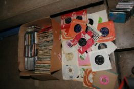 A TRAY CONTAINING ONE HUNDRED ADN SEVENTY 7in SINGLES and seventy CDs from artists such as Sex