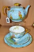 AN AYNSLEY TEAPOT WITH BUTTERFLY FINIAL, AND MATCHING TRIO, pattern B153, teapot and cup with relief