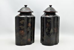 A PAIR OF ORIENTAL BLACK LACQUERED PAPIER MACHE TEA CANNISTERS AND COVERS OF SHAPED OVAL FORM, the