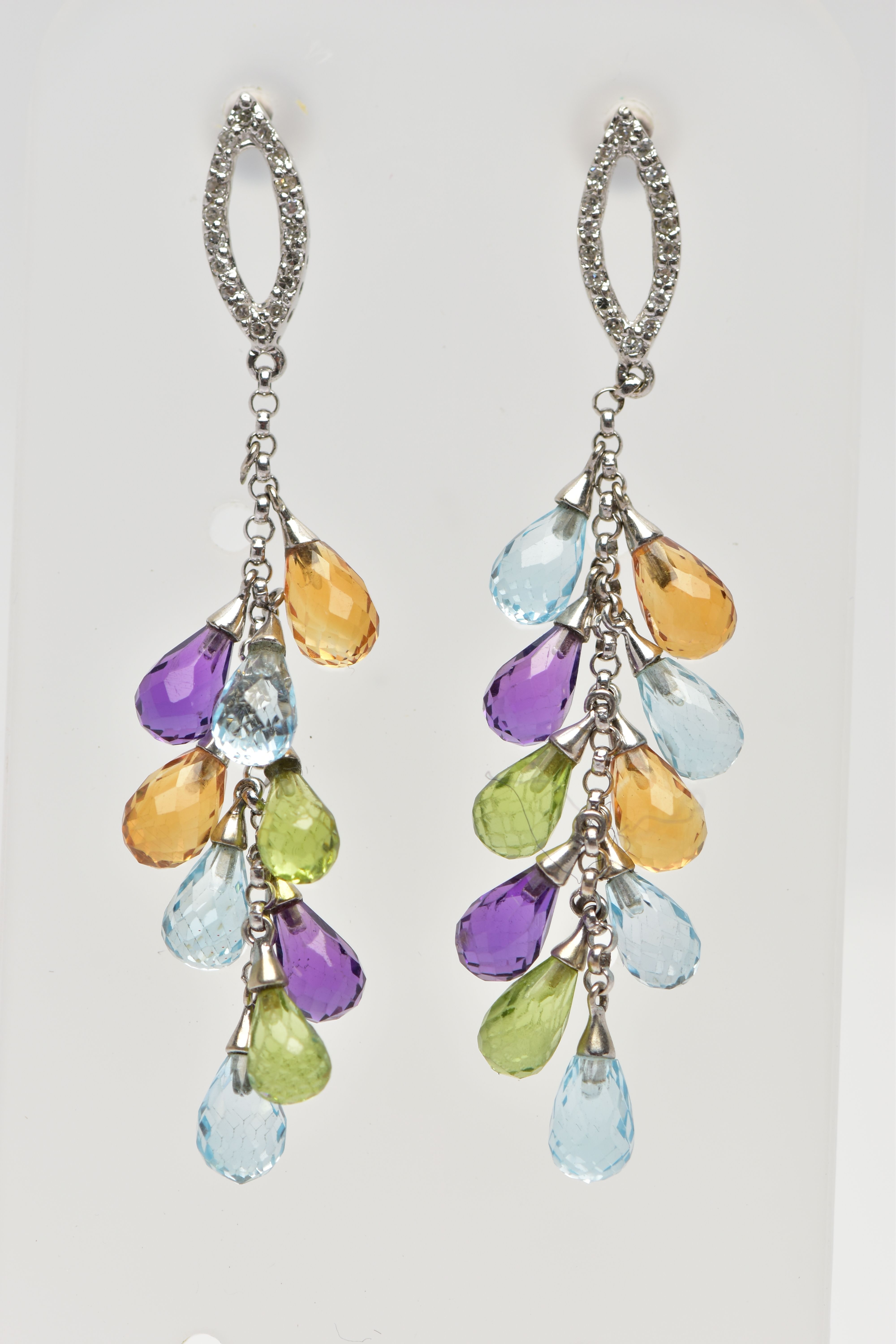 A PAIR OF WHITE METAL MULTI GEMSTONE SET DROP EARRINGS, each earring designed with an openwork