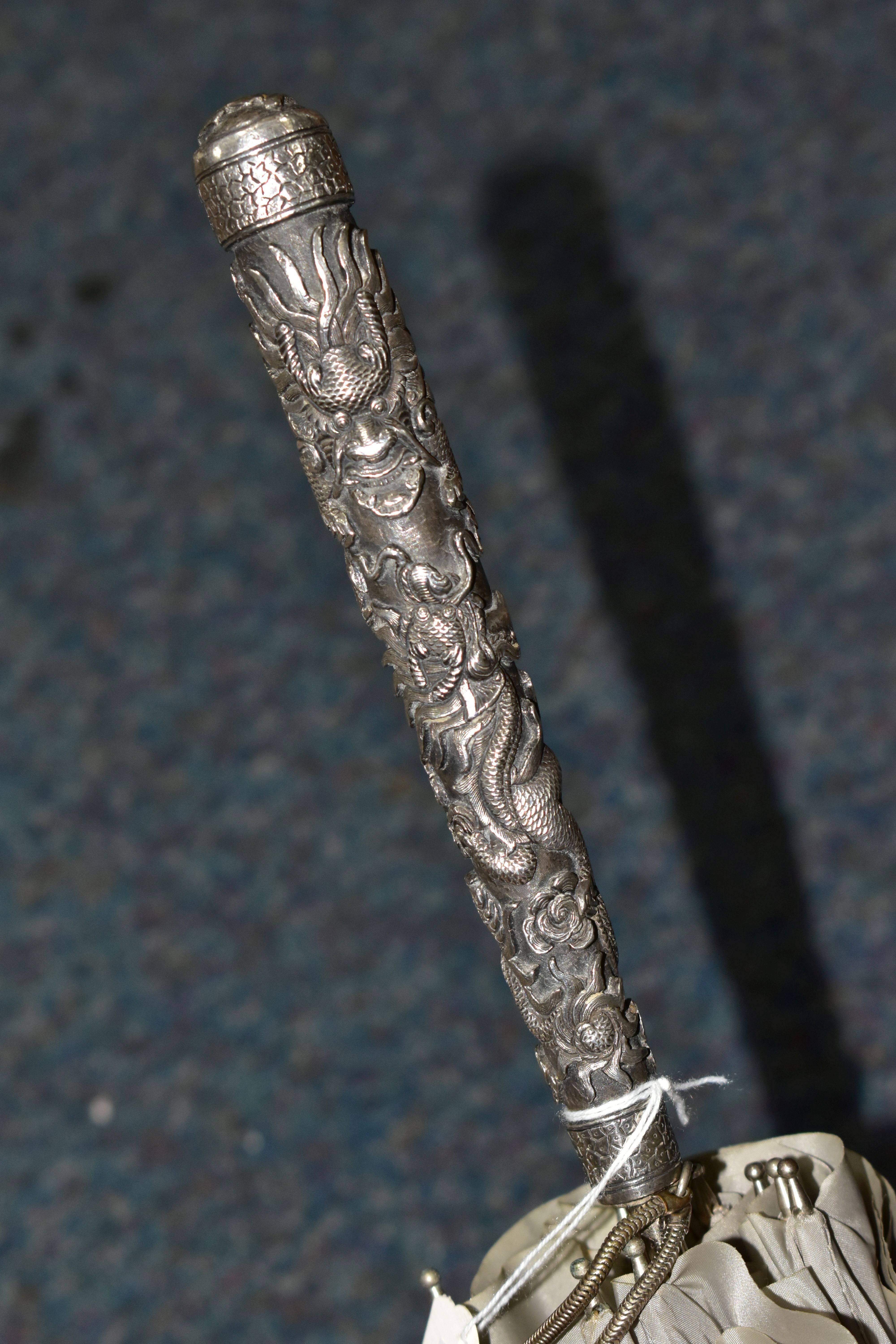 A CHINESE SILVER AND GREY UMBRELLA/PARASOL, with a white metal handle embossed with Dragons, - Image 6 of 7