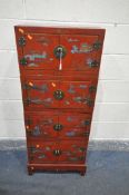A CHINESE STYLE RED FINISH FOUR SECTION STACKING CABINET, each fitted with double doors, decorated