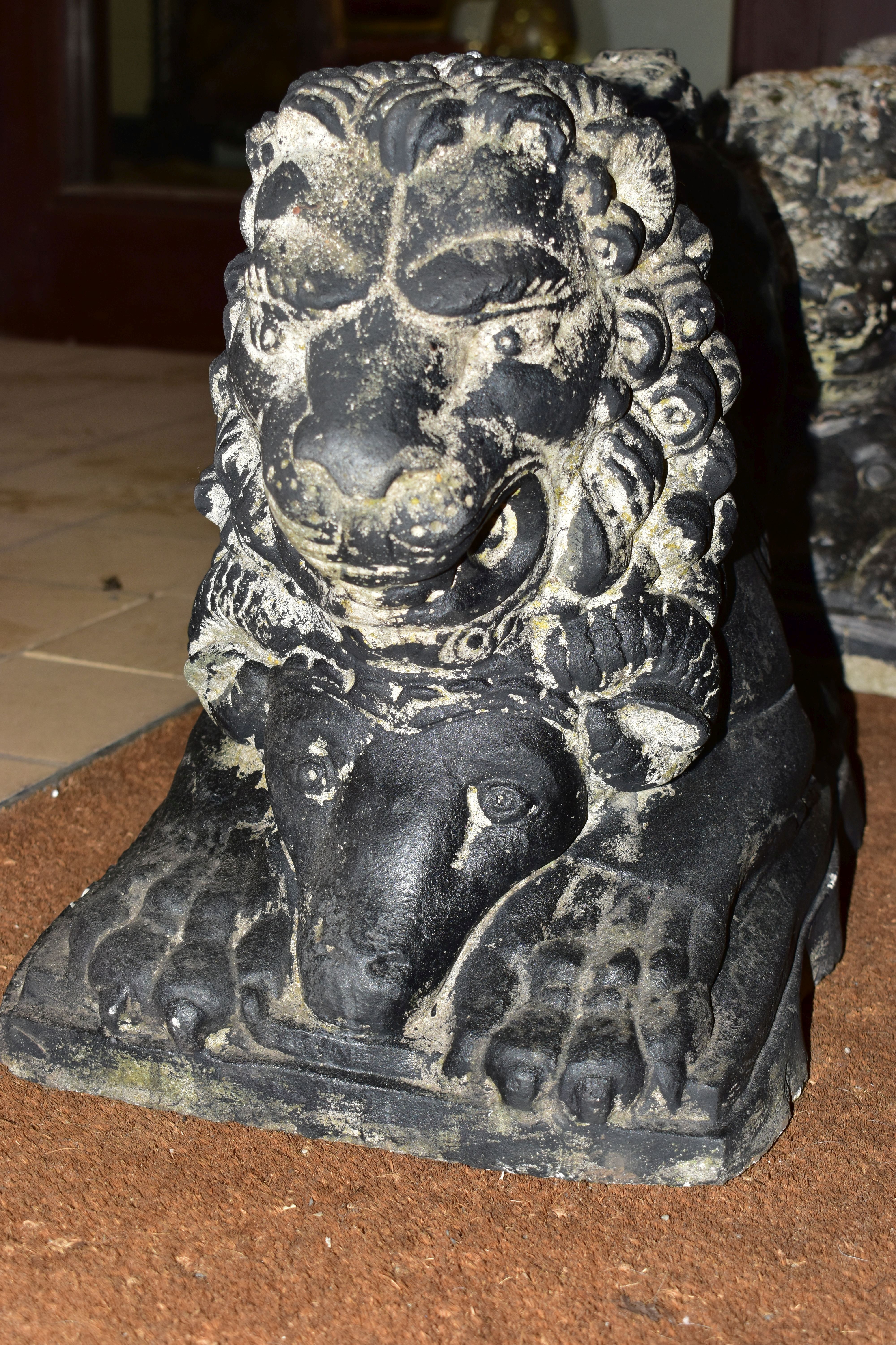 A PAIR OF BLACK PAINTED RECONSTITUTED CONCRETE GARDEN ORNAMENTS IN THE FORM OF LIONS, cast with a - Image 2 of 9