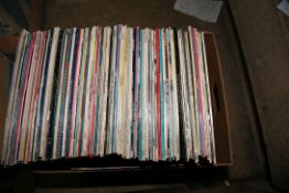 A TRAY CONTAINING OVER ONE HUNDRED AND TWENTY LPs from artists such as Paul Young, Dolly Parton, The