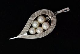 A WHITE METAL BROOCH, designed as a leaf, set with five fresh water cultured pearls, measuring