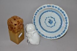 AN EIGHTEENTH CENTURY DELFT PLATE AND ORIENTAL ITEMS, comprising a carved stone table seal with
