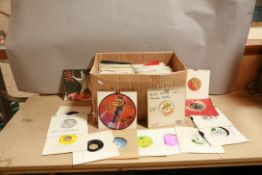 A TRAY CONTAINING OVER ONE HUNDRED AND FORTY 7in SINGLES of mostly 1970s and 1980s Rock Music