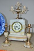 A LATE 19TH CENTURY FRENCH MARBLE CLOCK GARNITURE with key, a cream enamel dial marked Comptoir
