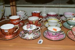TWENTY ONE AYNSLEY TEA CUPS AND SAUCERS, assorted patterns including florals, gilt bands and solid