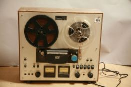 AN AKAI GX-230D REEL TO REEL RECORDER with two boxes of tape reels, ( untested due to no plug)