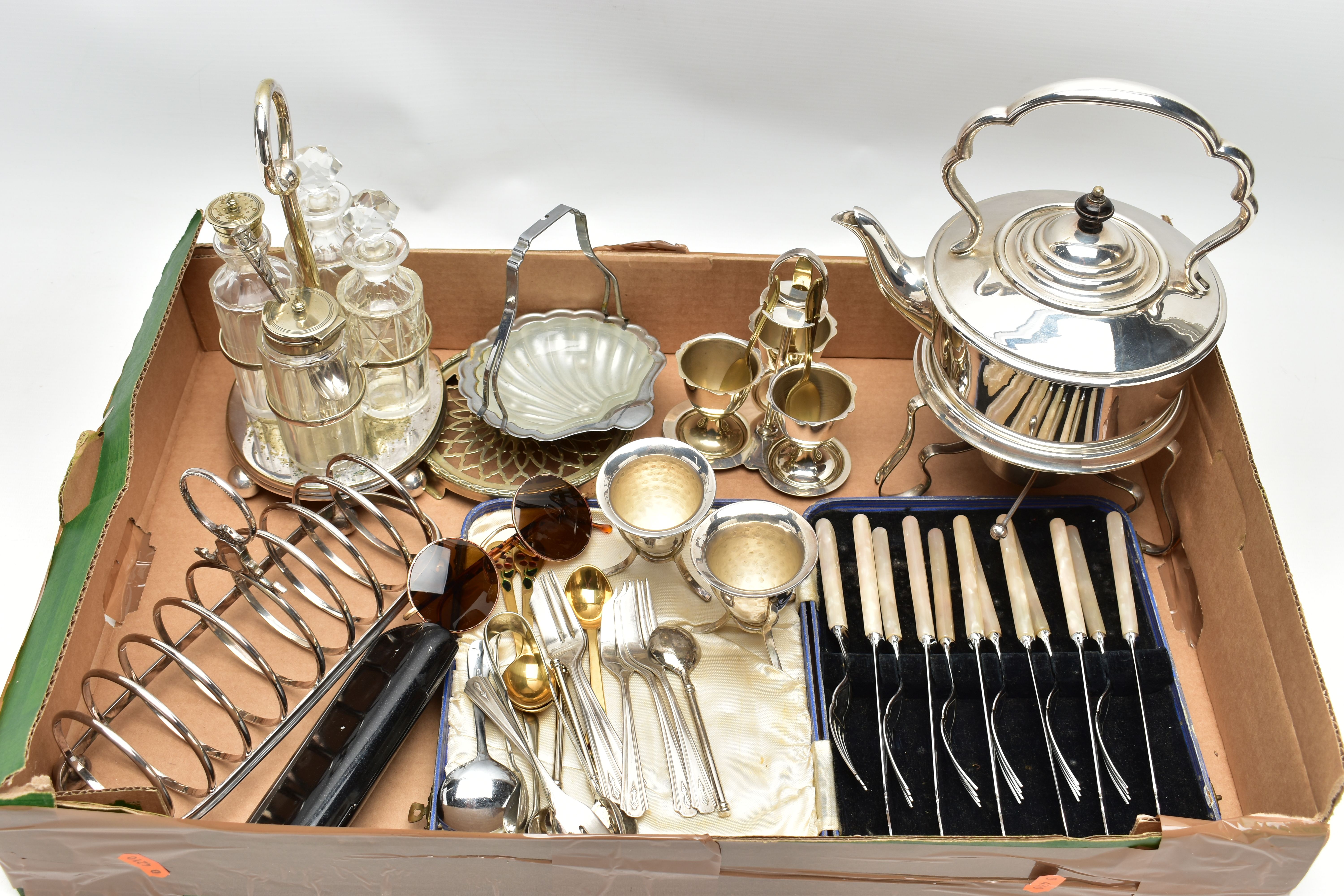 A BOX OF WHITE METAL TABLEWARE, to include a kettle on a stand, a three egg stand, two egg cups, a