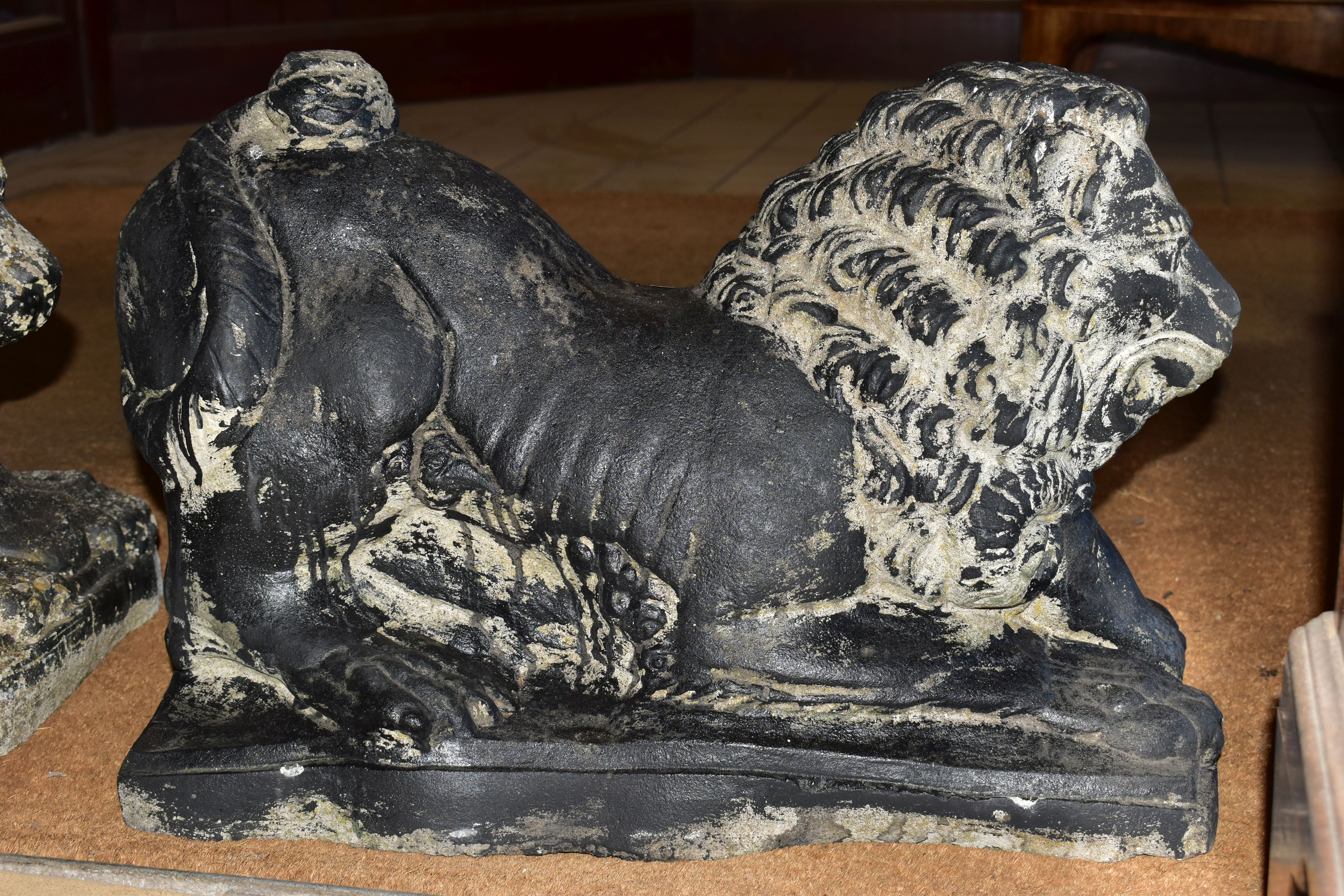A PAIR OF BLACK PAINTED RECONSTITUTED CONCRETE GARDEN ORNAMENTS IN THE FORM OF LIONS, cast with a - Image 9 of 9