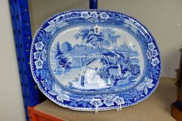 A LARGE BLUE AND WHITE PLATTER, decorated with a pastoral scene, Fallow deer in foreground, length