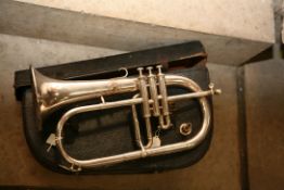 A BESSON AND CO FLUGELHORN in case with mouthpiece, silver coloured finish, No to centre valve