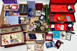 A LARGE ASSORTMENT OF COSTUME JEWELLERY AND BOXES, to include copper bangles, assorted earrings,