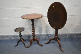 A 20TH CENTURY MAHOGANY TRIPOD TABLE, with a circular top, and barley twist support, diameter 46cm x
