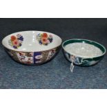 TWO TWENTIETH CENTURY ORIENTAL BOWLS one having repeating panels of floral and geometric motifs,