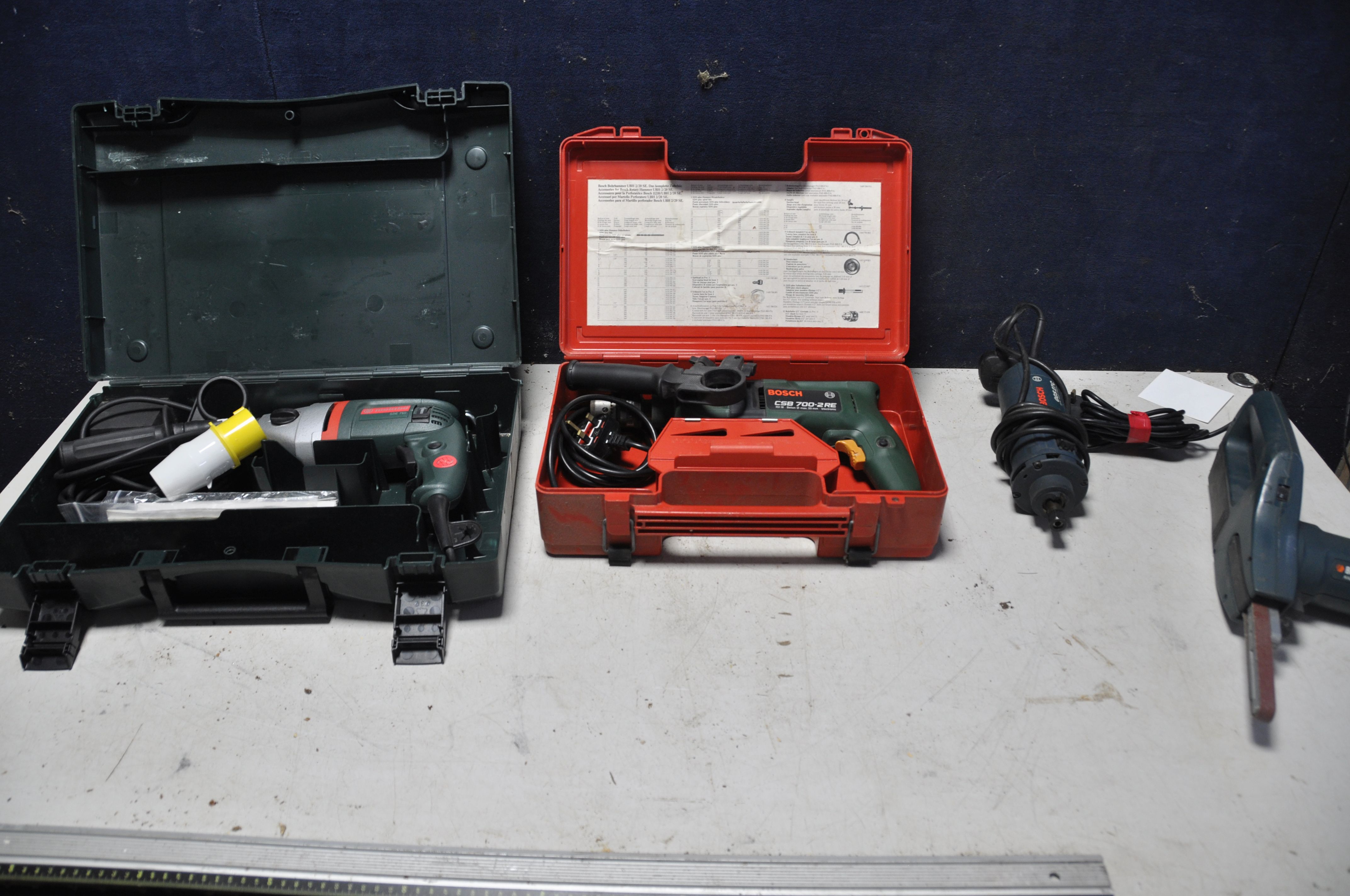 A METABO SBE750 DRILL in original case with 110v plug along with a Bosch CSB 700-2RE drill in
