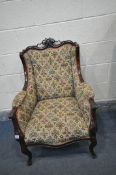 A FRENCH STYLE MAHOGANY WING BACK ARMCHAIR, scrolled top, swept armrests, on cabriole legs, width