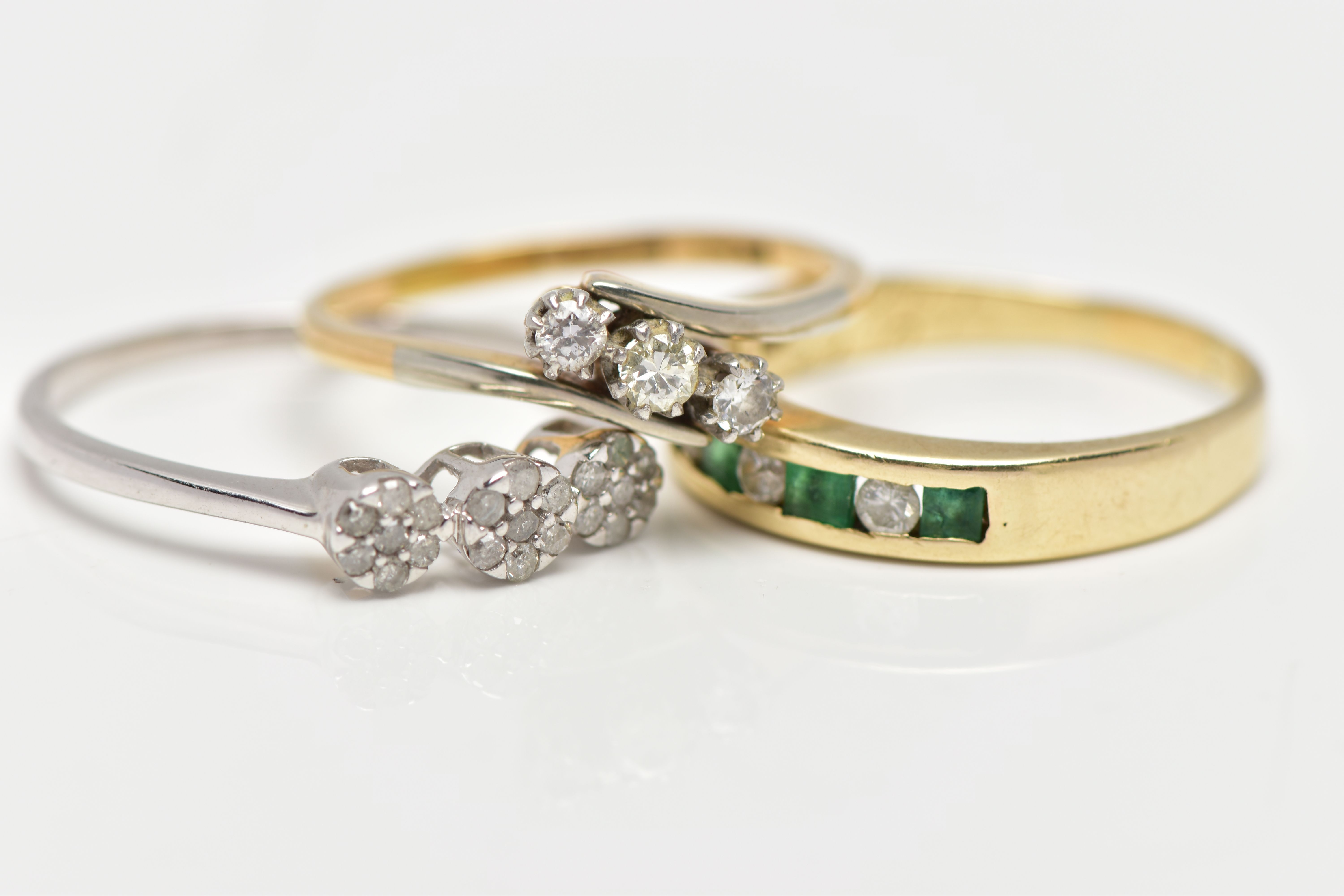 THREE GEM SET RINGS, the first a yellow metal half eternity ring set with four square cut emeralds - Image 3 of 4