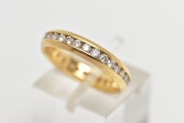 AN 18CT GOLD, FULL DIAMOND ETERNITY BAND, designed with a row of channel set, round brilliant cut