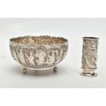 AN EMBOSSED WHITE METAL BOWL AND SMALL VASE, the round bowl decorated with embossed multiple figural