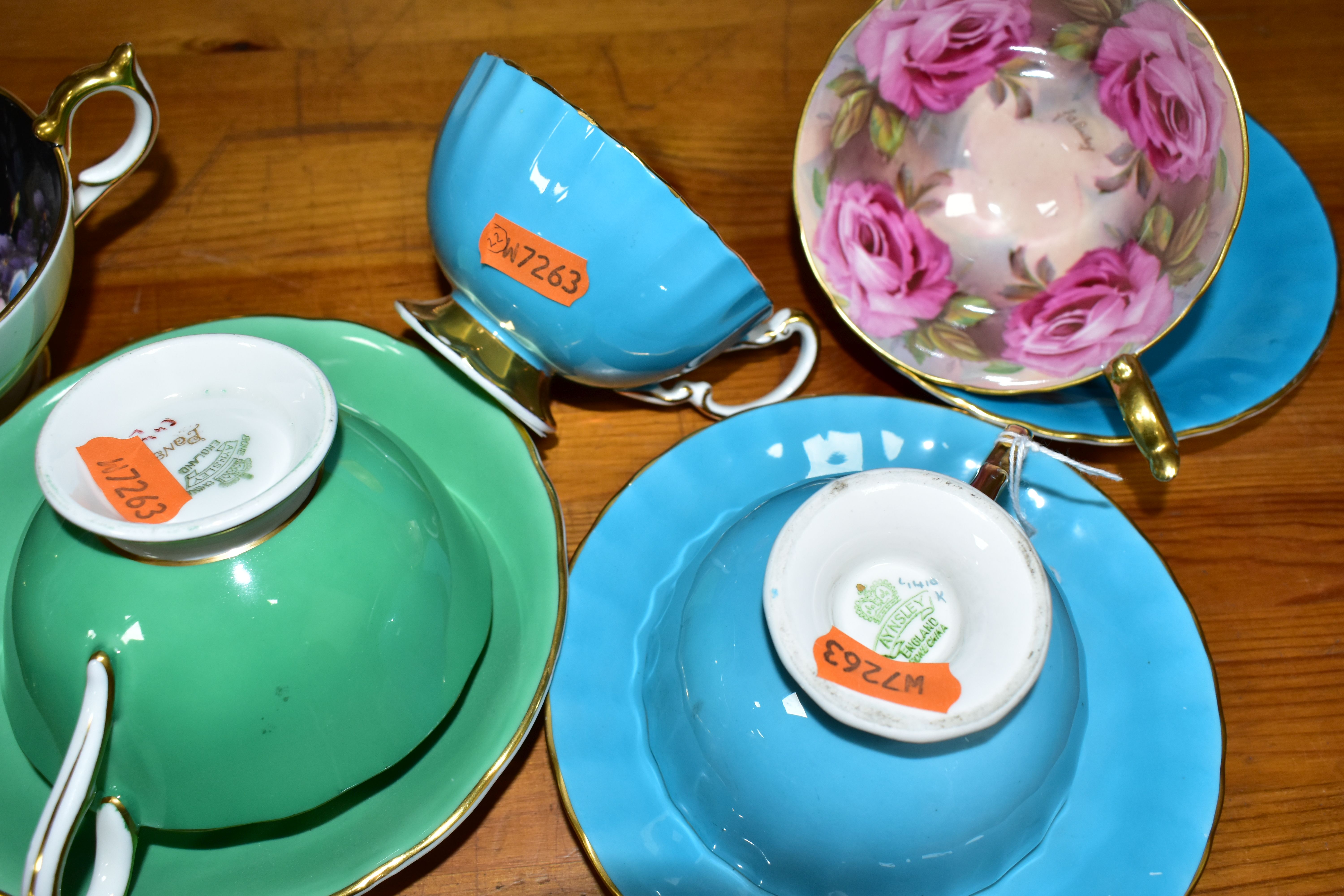 SIX AYNSLEY CABINET CUPS AND THREE SAUCERS, comprising a green cup and saucer, the interior of the - Image 7 of 7
