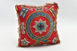 A LATE VICTORIAN VELVET BEADWORK PIN CUSHION OF SQUARE FORM WITH ORDER OF THE GARTER TO THE