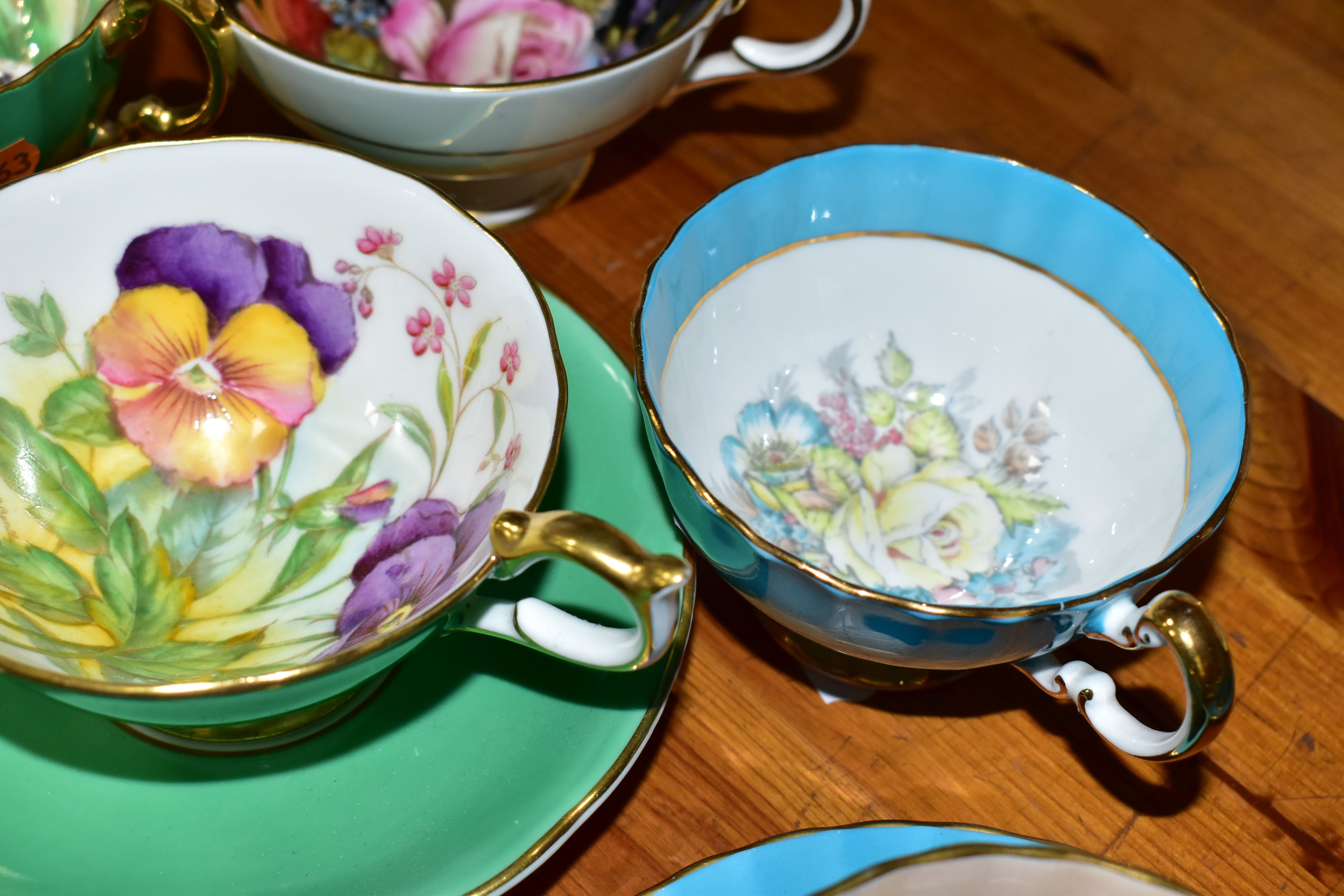 SIX AYNSLEY CABINET CUPS AND THREE SAUCERS, comprising a green cup and saucer, the interior of the - Image 6 of 7