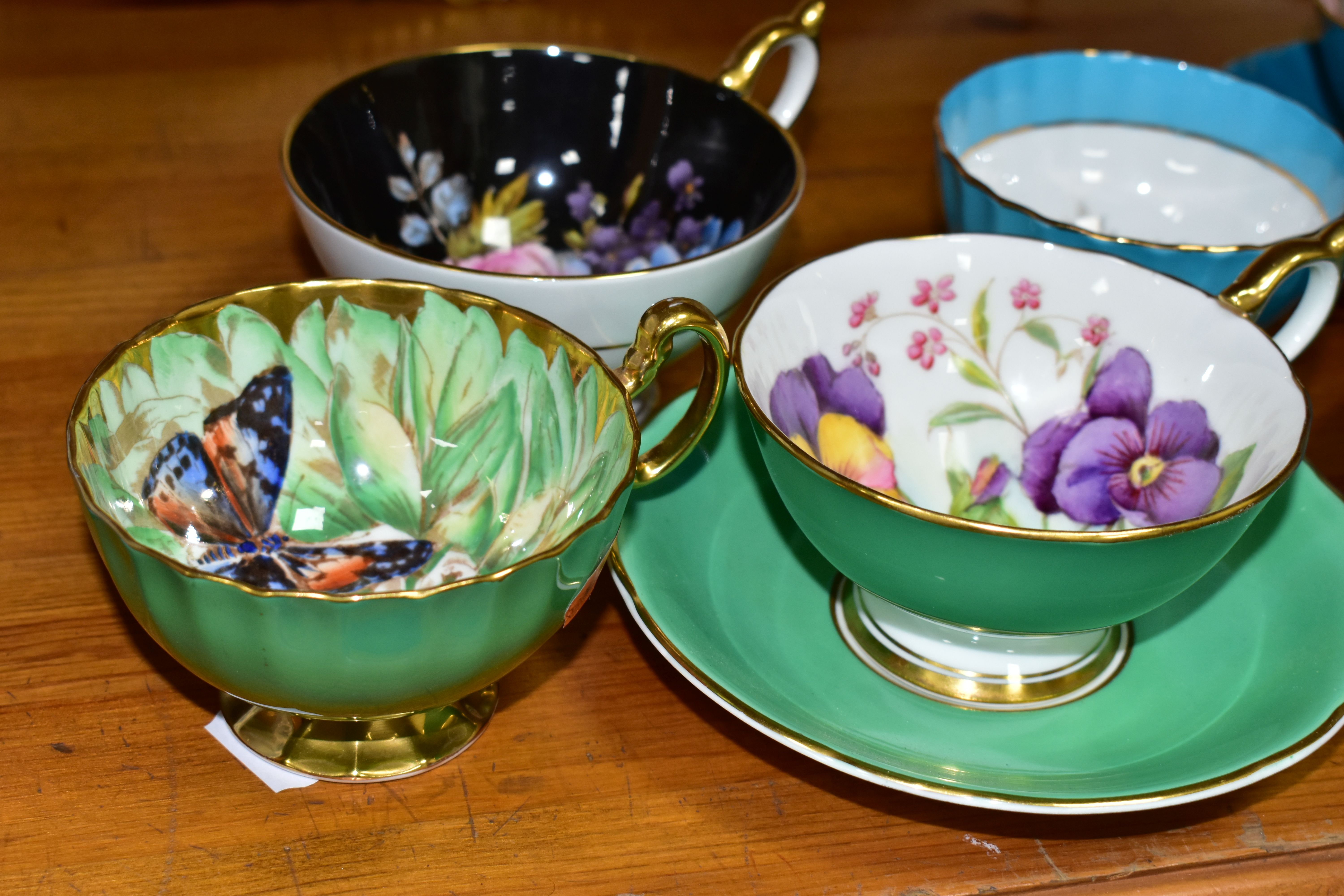 SIX AYNSLEY CABINET CUPS AND THREE SAUCERS, comprising a green cup and saucer, the interior of the - Image 2 of 7