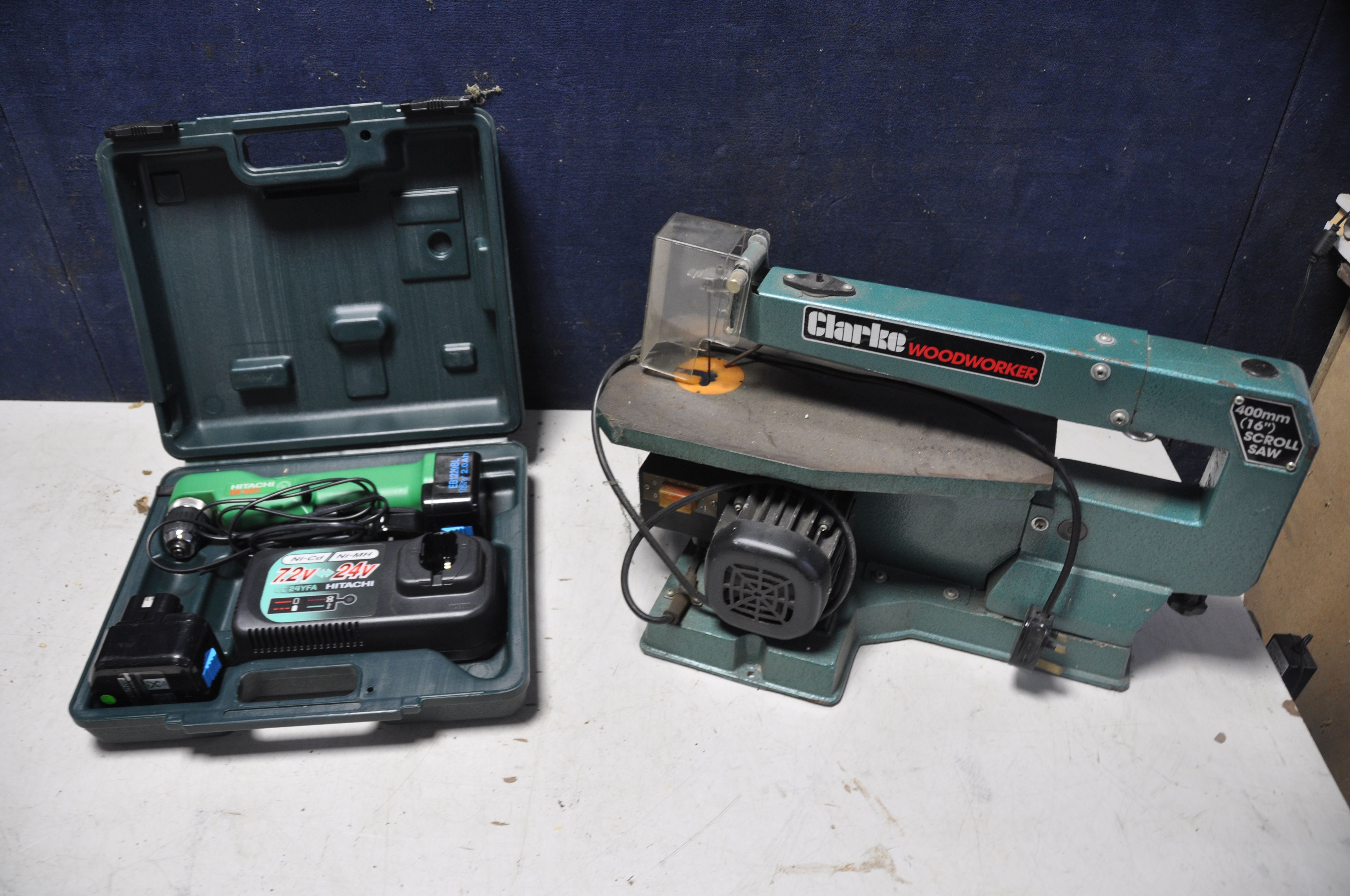 A CLARKE CSS400 SCROLL SAW with blade along with a Hitachi DN12DY cordless angle drill in original