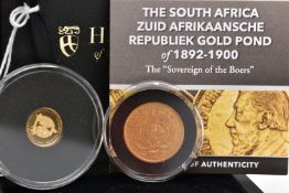 A CASED SOUTH AFRICAN ZUID GOLD POND AND A QUARTER SOVEREIGN, dated 1900, within a protective