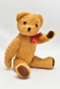 A PEDIGREE GOLDEN PLUSH MUSICAL TEDDY BEAR, stitched nose, plastic eyes, jointed body, brown