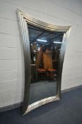 A LARGE RECTANGULAR SILVER PAINTED MIRROR, with concave edges, 216cm x 124cm (condition - minor