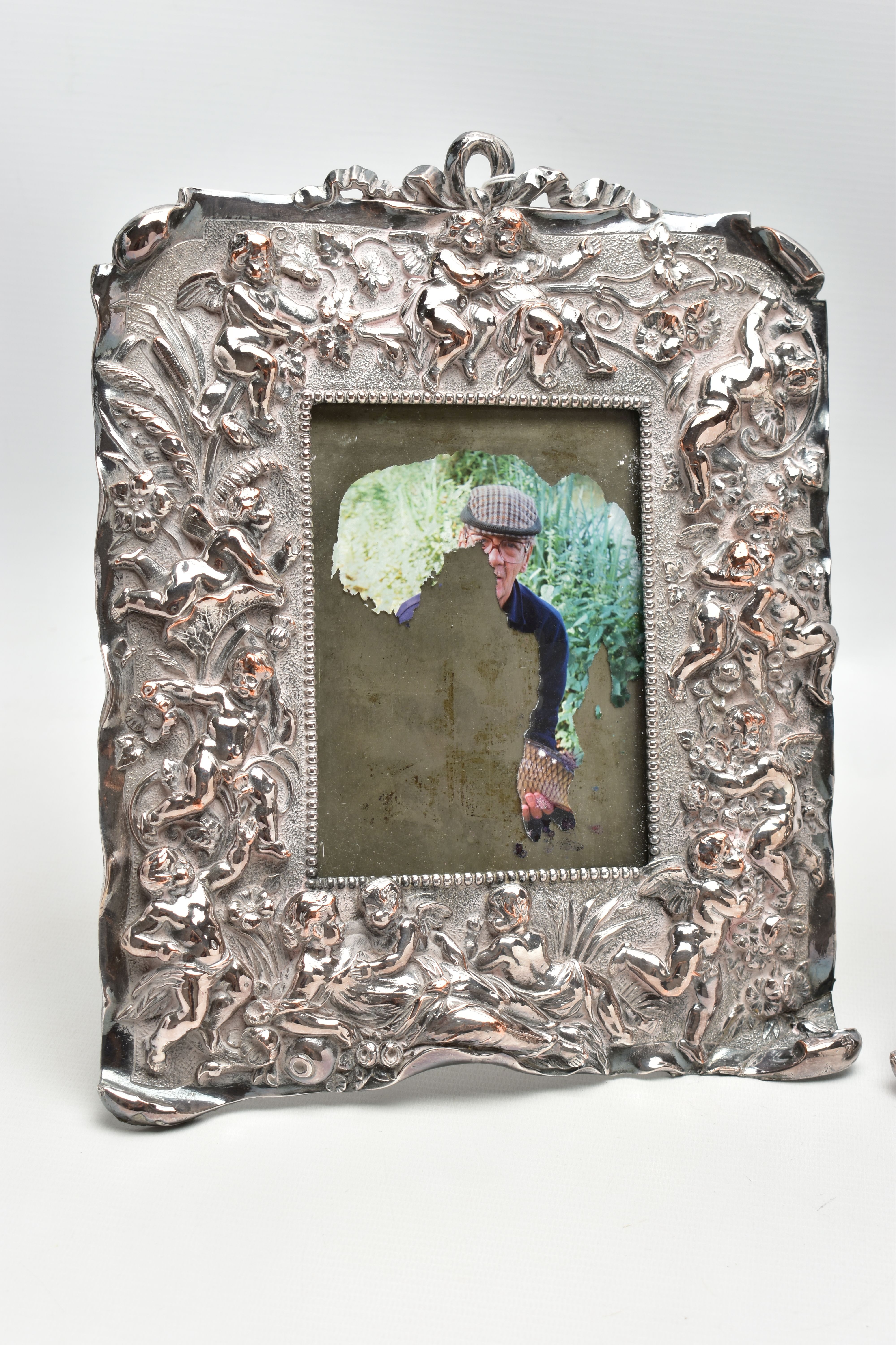 A PAIR OF WHITE METAL PHOTO FRAMES, rectangular form, detailed with a number of cherubs, a woman and - Image 4 of 7
