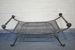 A WROUGHT IRON CURVED BENCH, with strapwork seat, length 123cm x depth 50cm x height 62cm (condition