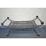 A WROUGHT IRON CURVED BENCH, with strapwork seat, length 123cm x depth 50cm x height 62cm (condition