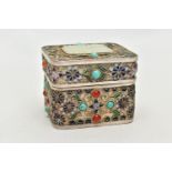 A WHITE METAL, ENAMEL AND GEM SET BOX, of a rectangular form, decorated with enamelled flowers and