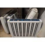 A COLLECTION OF RADIATORS to include three dimplex RMG20TI heaters, a Currys convector heater and